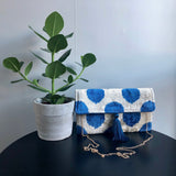 Blue doted Ikat clutch bag with gold chain