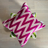 Velvet Ikat Cushion Zigzag Pink on green cushion