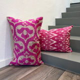 Velvet Ikat Pillow Pink Paradise standing against wall