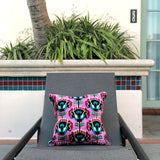 Velvet Ikat Cushion Miami Vice on chair.