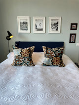 Velvet Ikat Cushion Sealife on bed