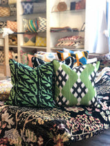 Velvet Ikat Cushion Tropical Leaves on bed