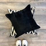 Velvet Ikat Cushion Zigzag Black below black cushion