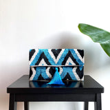 Ikat Clutch Bag with blue tassel in geometrical pattern