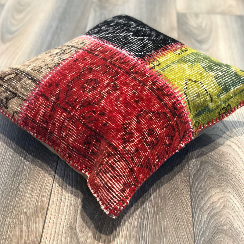 Patchwork pillow made from authentic wool carpets