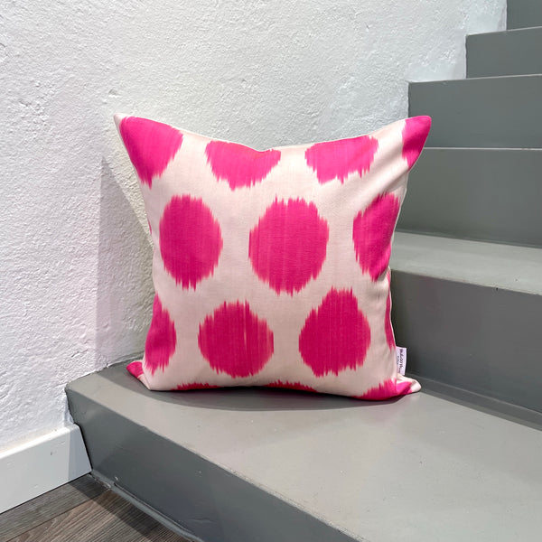 Pink neon dots cushion in silk ikat