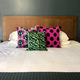 Velvet Ikat Cushion Tropical Leaves with other variants on bed