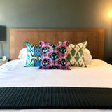 Velvet Ikat Cushion Miami Vice with other variant on bed