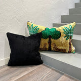 Velvet Ikat Cushion Black with other variant pillow on stair