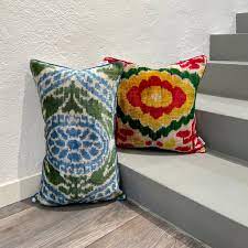 Velvet Ikat Cushion Maya Flower on stairs