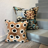 Velvet Ikat Cushion Espresso with other variant cushion on stairs