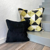 Velvet Ikat Cushion Black with other variant on stairs